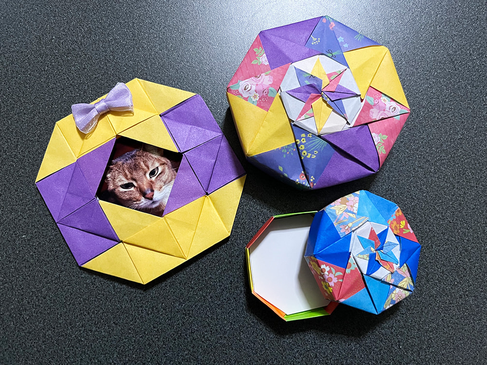 折り紙でできた写真フレームと小物入れ